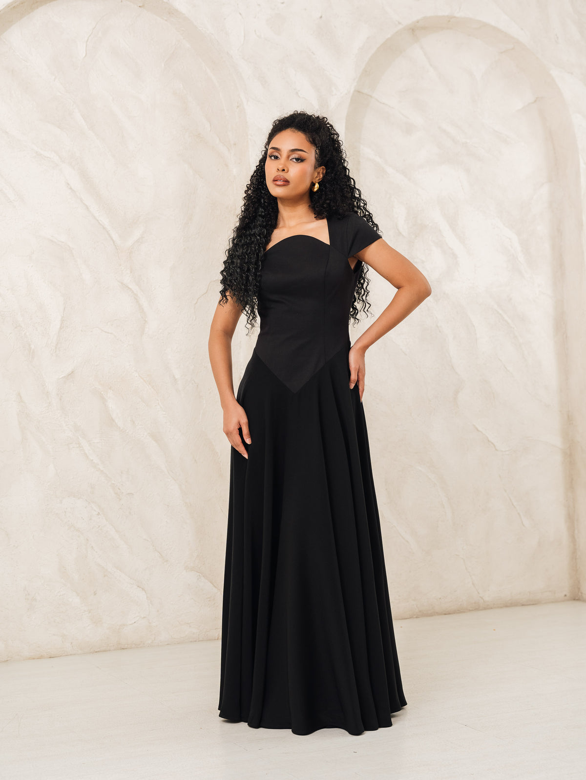 Fleur Elize Aurora black capsleeve flowy maxi dress front view elegant evening silhouette