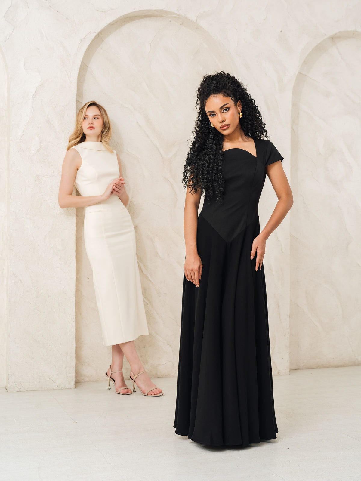 Fleur Elize Aurora black capsleeve flowy maxi dress front view elegant evening silhouette