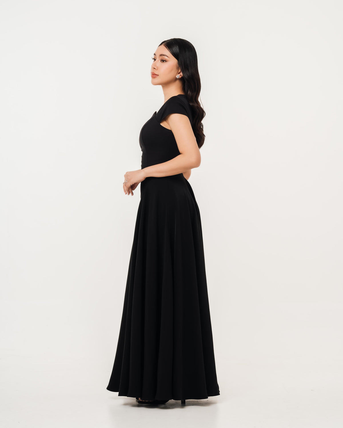 Fleur Elize Aurora black maxi dress side profile sleek wedding guest sophistication
