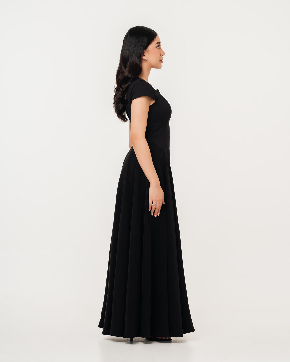 Fleur Elize Aurora black maxi dress side profile sleek wedding guest sophistication