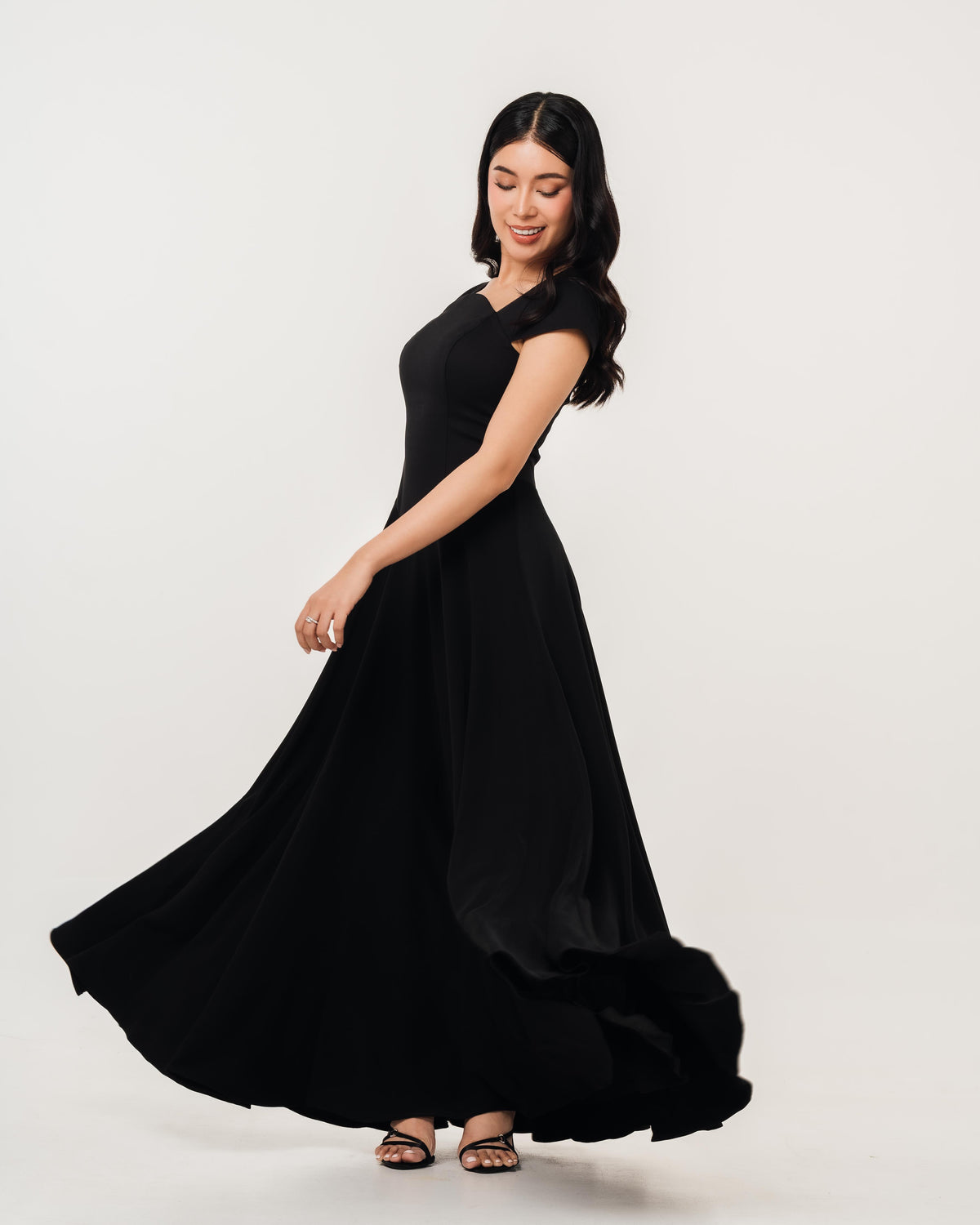 Fleur Elize Aurora black maxi dress side profile sleek wedding guest sophistication