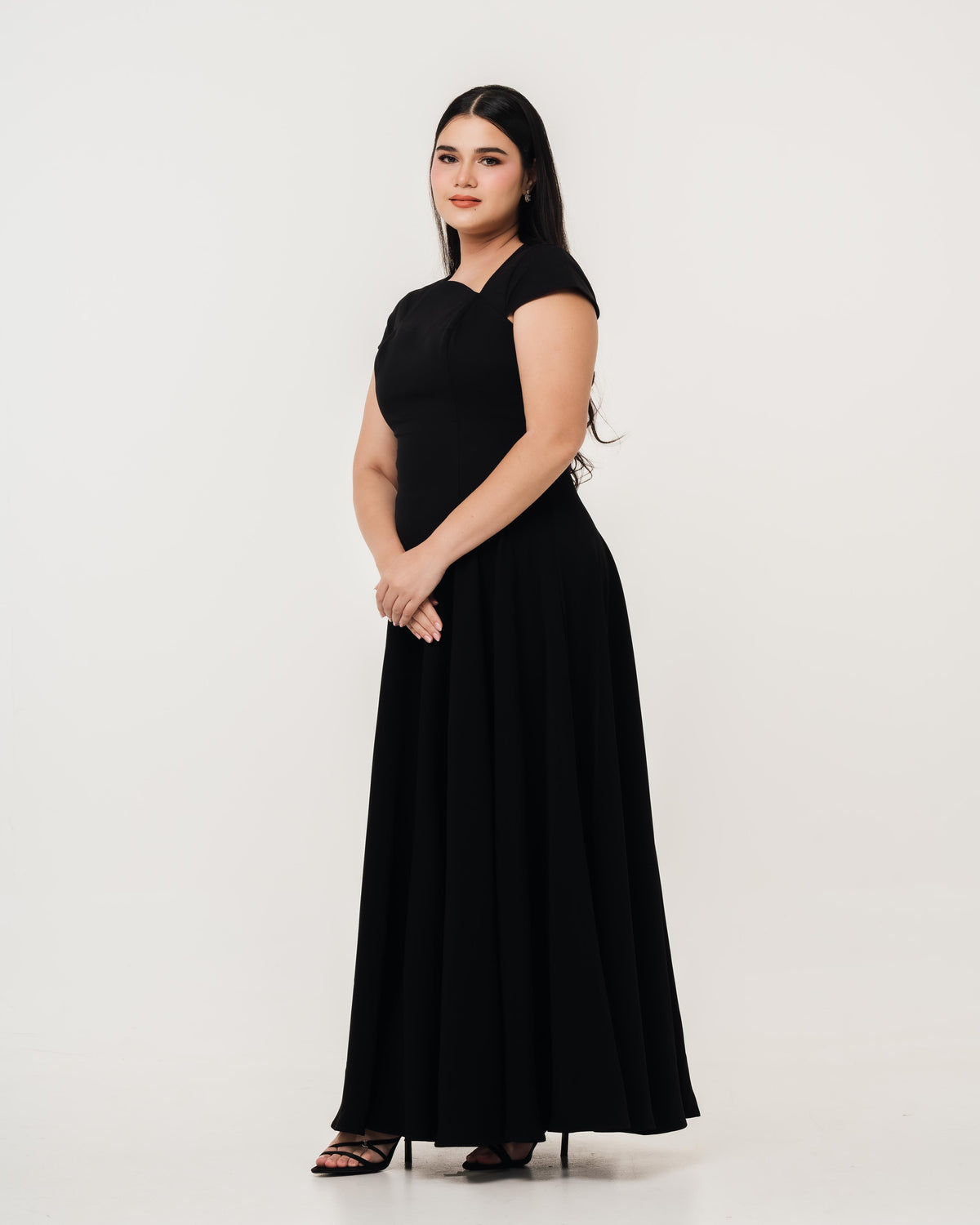 Fleur Elize Aurora black maxi dress side profile sleek wedding guest sophistication