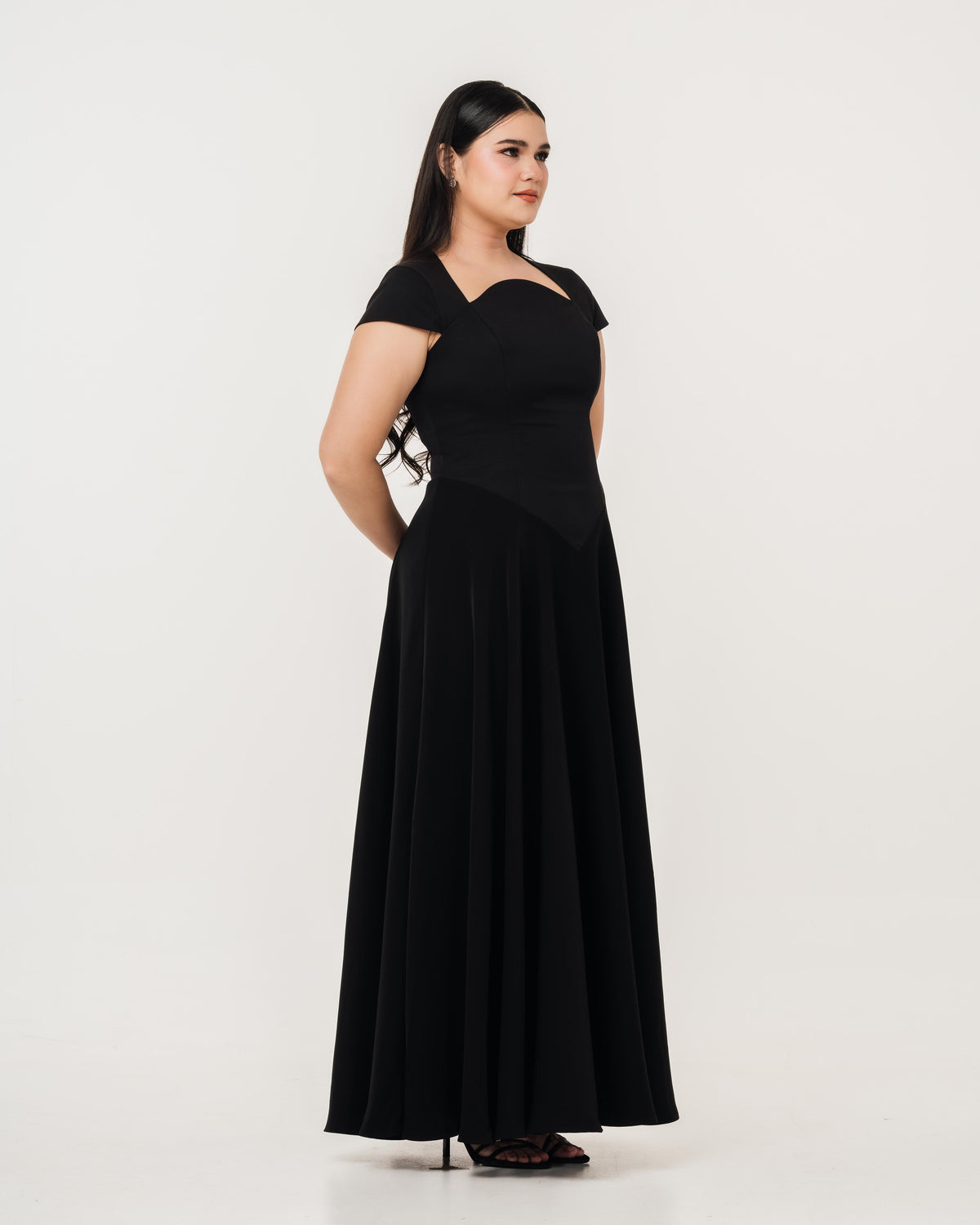 Fleur Elize Aurora black maxi dress side profile sleek wedding guest sophistication