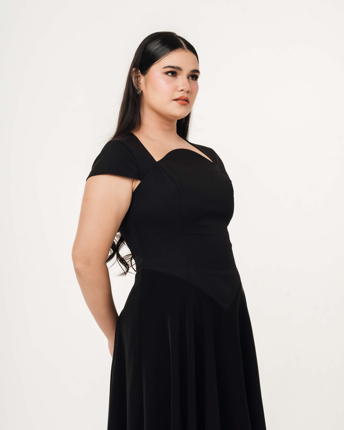 Fleur Elize Aurora black maxi dress side profile sleek wedding guest sophistication
