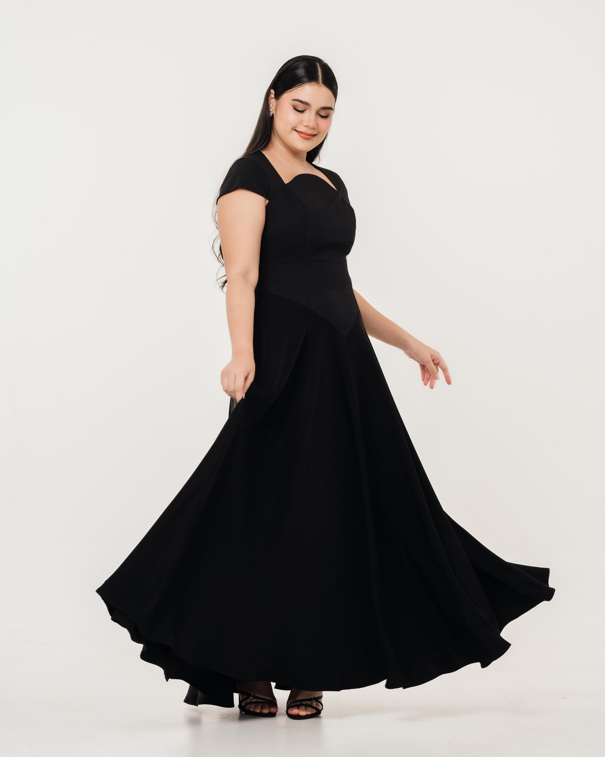 Fleur Elize Aurora black maxi dress side profile sleek wedding guest sophistication
