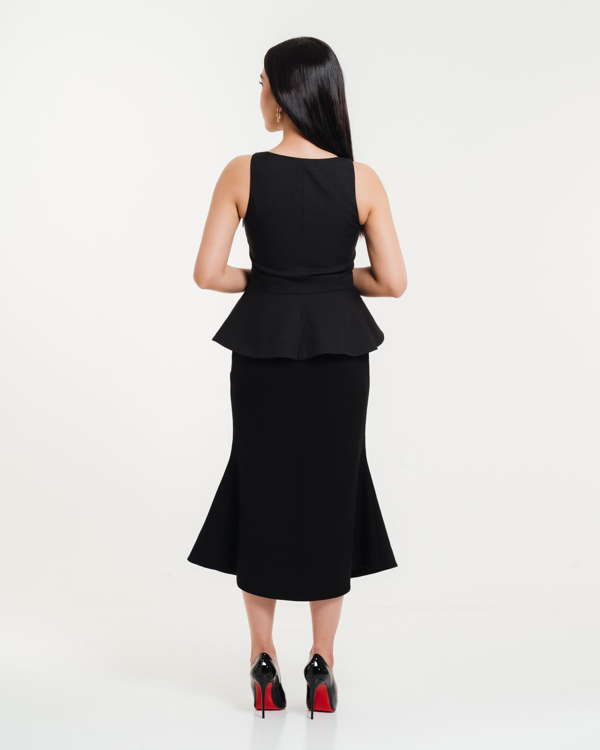 Fleur Elize Meredith black peplum top back view refined evening out styling