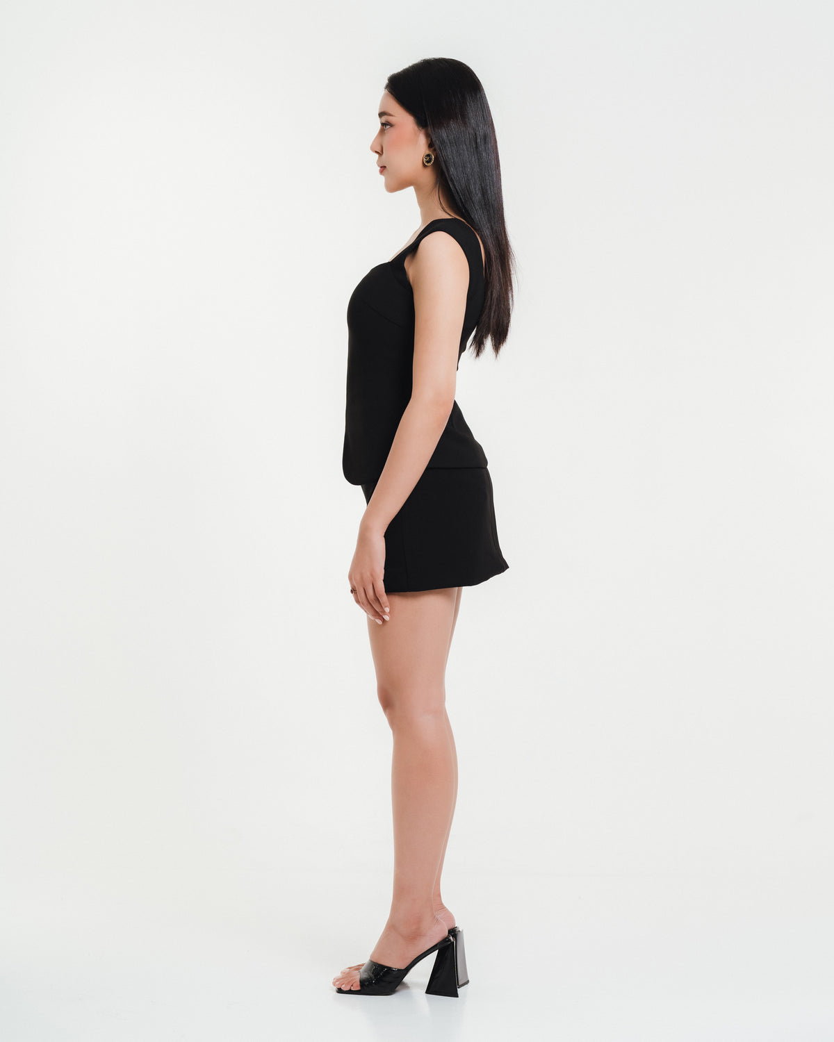 Fleur Elize Sienna black mini skirt side profile sleek date night sophistication