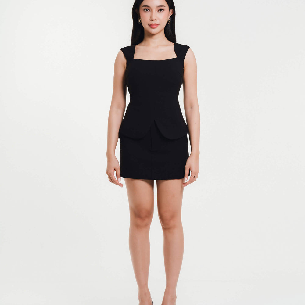 Fleur Elize black square-neck peplum top and mini skirt — elegant women’s boutique outfit photographed in minimalist studio